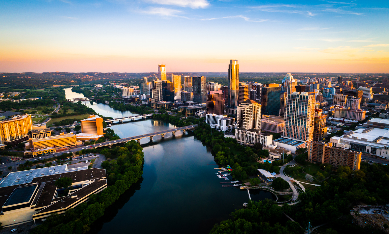 Sunrise cityscape skyline Austin, Texas at golden hour above tranquil Lady Bird Lake